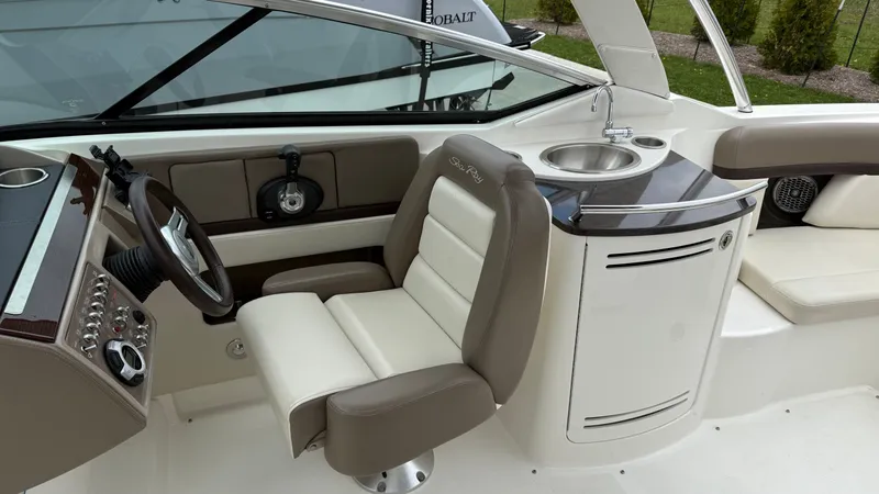 Slide: The Image of Interior of a 2013 Sea Ray 270 SLX with helm and sink. - 14