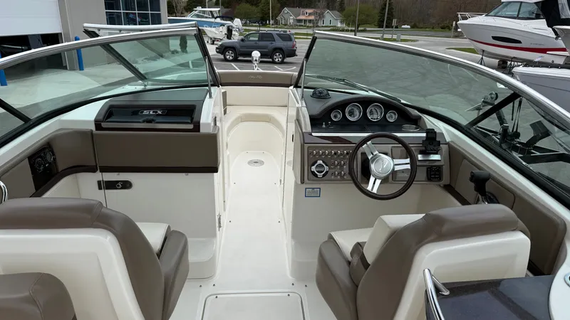 Slide: The Image of Interior of a 2013 Sea Ray 270 SLX boat with helm console. - 15