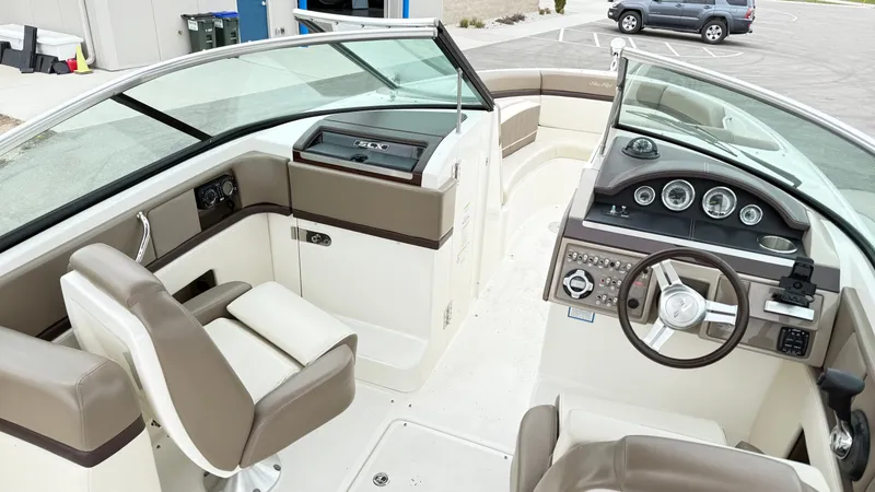 Slide: The Image of Interior of a 2013 Sea Ray 270 SLX boat with helm console. - 16