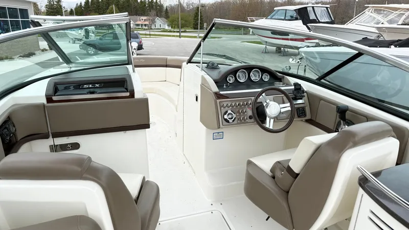 Slide: The Image of Interior of a 2013 Sea Ray 270 SLX boat with helm console. - 17