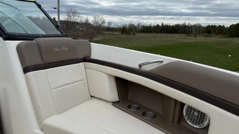 Slide: The Image of Interior of a 2013 Sea Ray 270 SLX boat with beige seating area. - 19