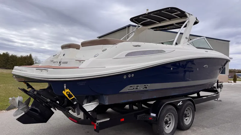 Slide: The Image of 2013 Sea Ray 270 SLX boat on trailer, side view. - 2