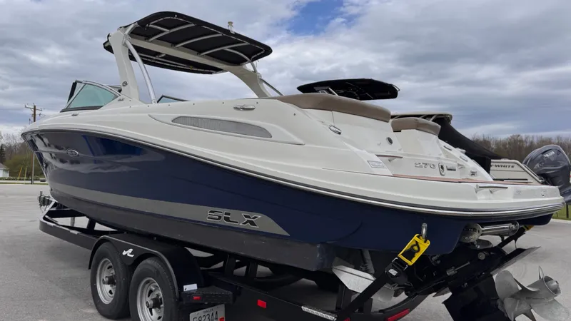 Slide: The Image of 2013 Sea Ray 270 SLX boat on trailer, side view. - 3