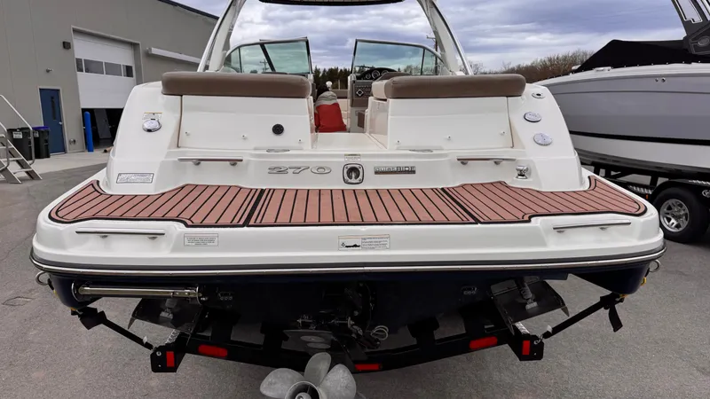 Slide: The Image of Rear view of a 2013 Sea Ray 270 SLX boat on a trailer. - 4