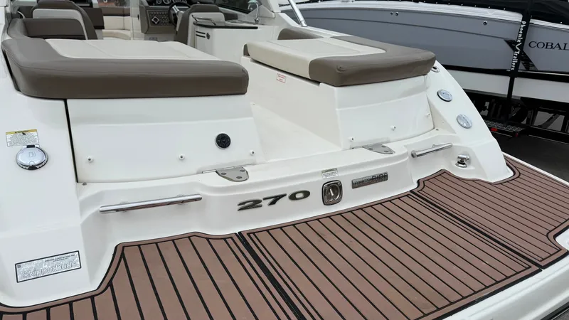 Slide: The Image of Rear view of a 2013 Sea Ray 270 SLX boat with teak deck. - 6