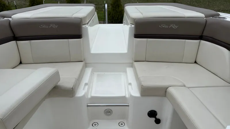 Slide: The Image of Interior of a 2013 Sea Ray 270 SLX with beige upholstery. - 7