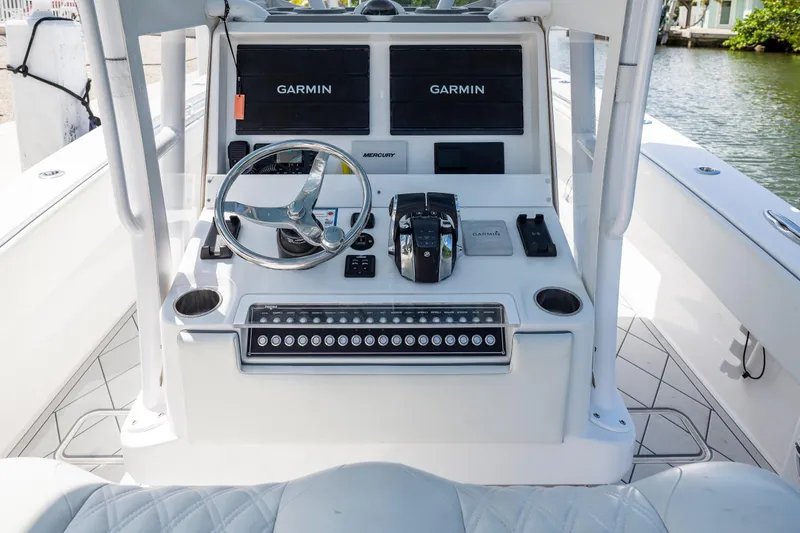 Slide: The Image of Center console of 2021 Invincible 33 Open Fisherman boat with Garmin displays. - 15