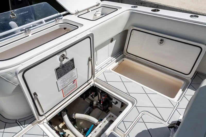 Slide: The Image of 2021 Invincible 33 Open Fisherman boat storage compartments and utility access. - 19