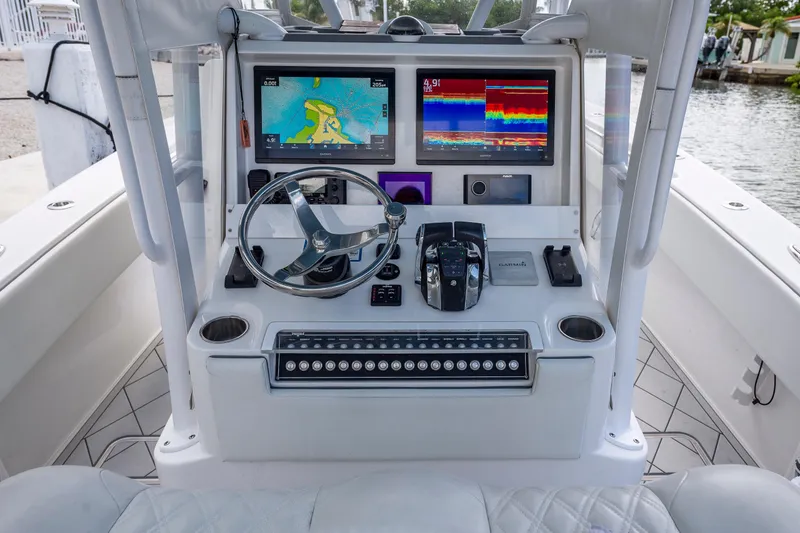 Slide: The Image of Center console of 2021 Invincible 33 Open Fisherman with advanced navigation displays. - 22