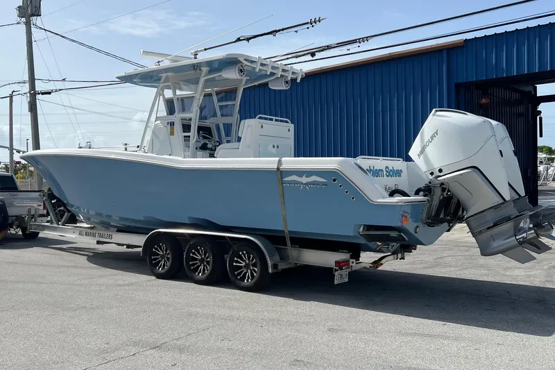 Slide: The Image of 2021 Invincible 33 Open Fisherman boat on trailer, parked outdoors. - 6