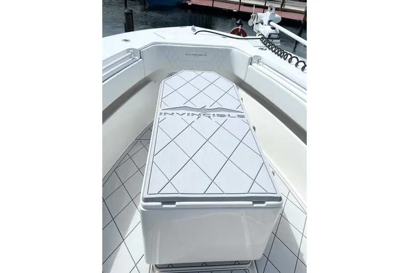 Slide: The Image of 2021 Invincible 33 Open Fisherman boat interior with branded deck and seating. - 7
