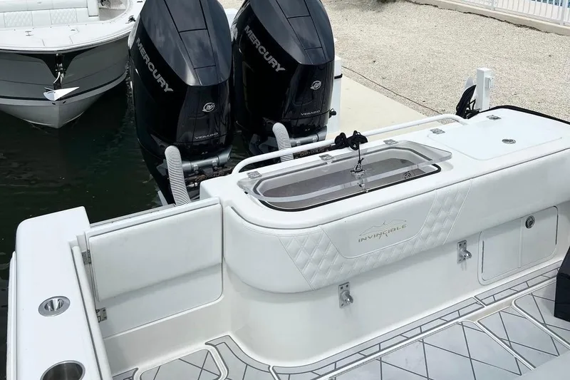 Slide: The Image of 2021 Invincible 33 Open Fisherman boat with dual Mercury engines at dock. - 9