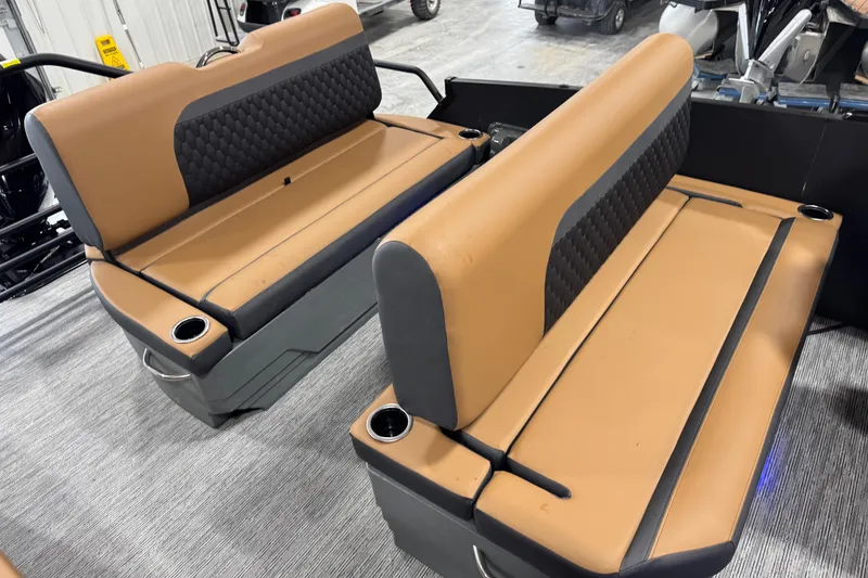Slide: The Image of 2026 Sylvan L5 DLZ boat seats with tan and black upholstery, featuring cup holders. - 13