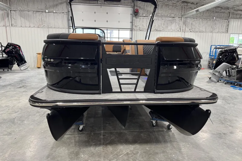 Slide: The Image of 2026 Sylvan L5 DLZ pontoon boat in a warehouse setting. - 7