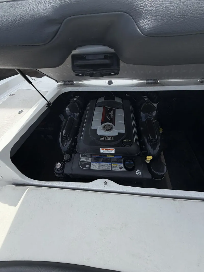 Slide: The Image of Engine compartment of a 2018 Stingray 195 LX boat with 200 HP engine. - 7