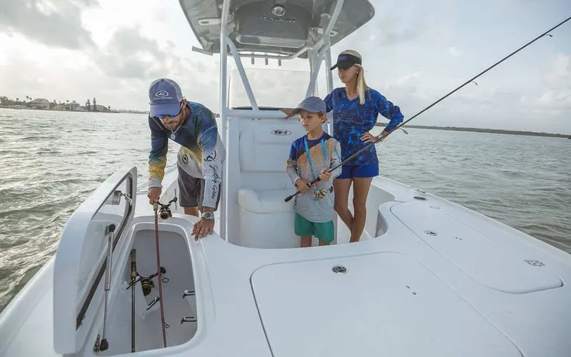 Slide: The Image of Family fishing on a 2026 Sea Hunt BX 22 BR boat. - 10
