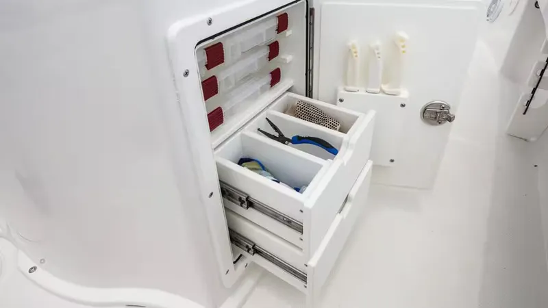 Slide: The Image of 2026 Sea Hunt BX 22 BR boat storage with tools. - 16