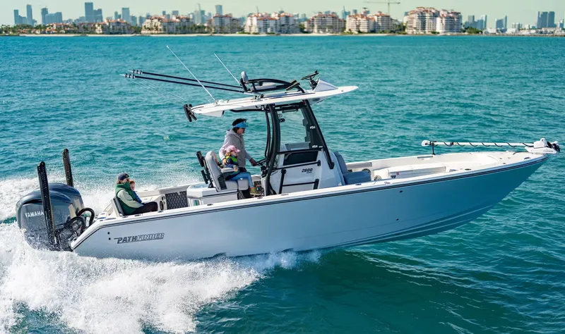 The Image of Pathfinder 2800 Hybrid 2026 on water with city skyline in background. - 1