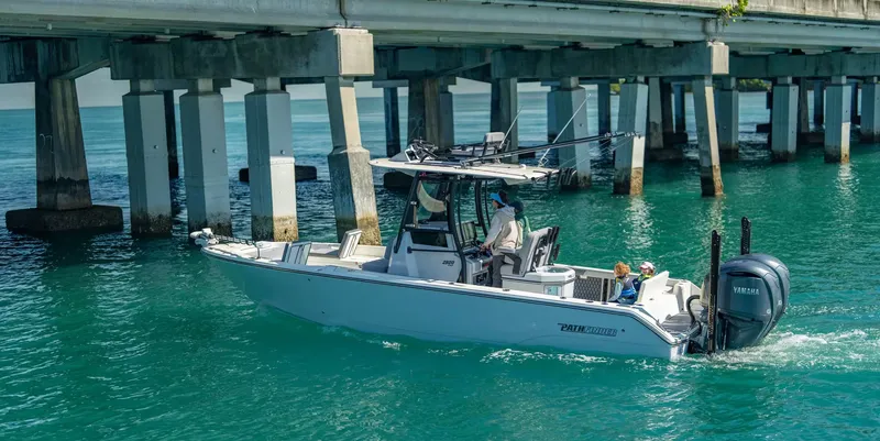 Slide: The Image of 2026 Pathfinder 2800 Hybrid boat under bridge on blue water. - 4