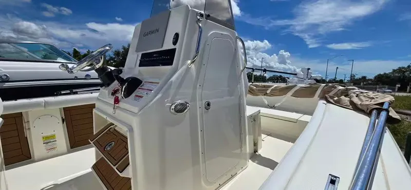 Slide: The Image of 2024 Pathfinder 2400 Open boat with helm console and Garmin system. - 14