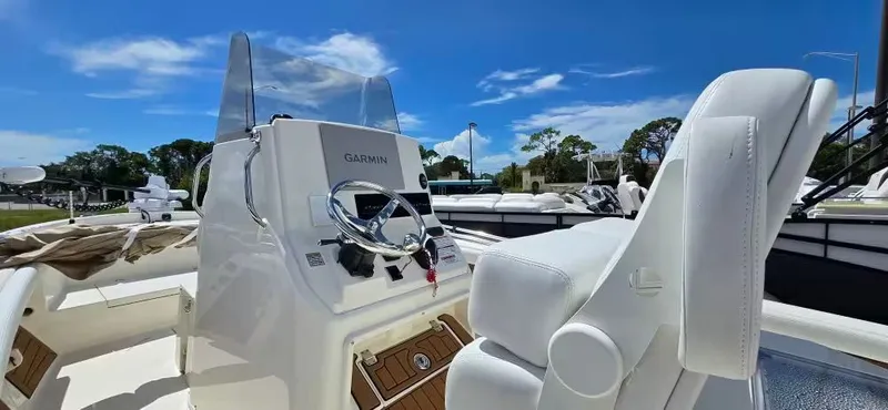 Slide: The Image of Interior view of 2024 Pathfinder 2400 Open boat with helm console. - 15