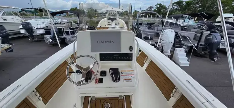 Slide: The Image of Interior view of 2024 Pathfinder 2400 Open with Garmin controls. - 16