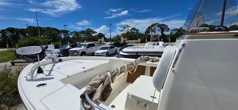 Slide: The Image of 2024 Pathfinder 2400 Open boat in parking lot under sunny skies. - 17