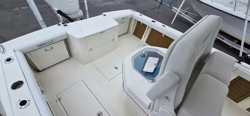 Slide: The Image of Interior of 2024 Pathfinder 2400 Open boat, featuring seating and storage. - 9