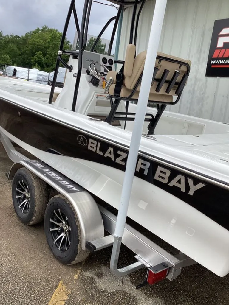 Slide: The Image of 2026 Blazer PureBay 2400 boat on trailer, side view. - 10