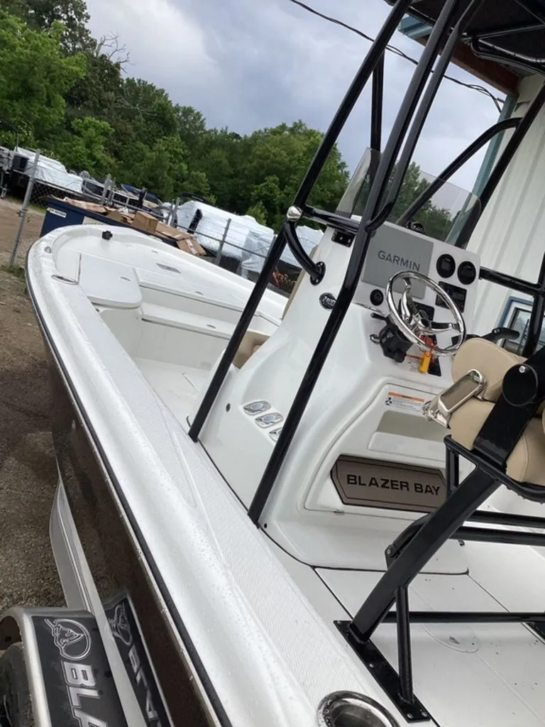 Slide: The Image of 2026 Blazer PureBay 2400 boat with Garmin controls, side view. - 13