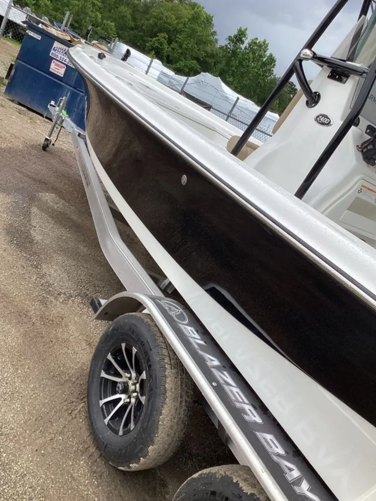 Slide: The Image of 2026 Blazer PureBay 2400 boat on trailer, side view. - 15