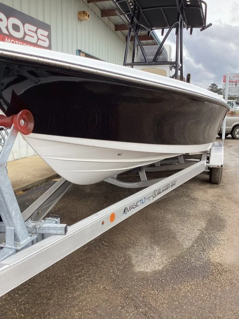Slide: The Image of 2026 Blazer PureBay 2400 boat on a trailer. - 16