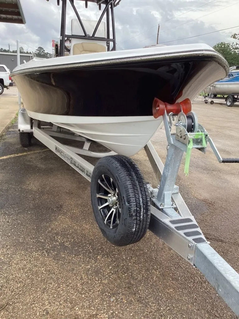 Slide: The Image of 2026 Blazer PureBay 2400 boat on trailer, side view. - 17