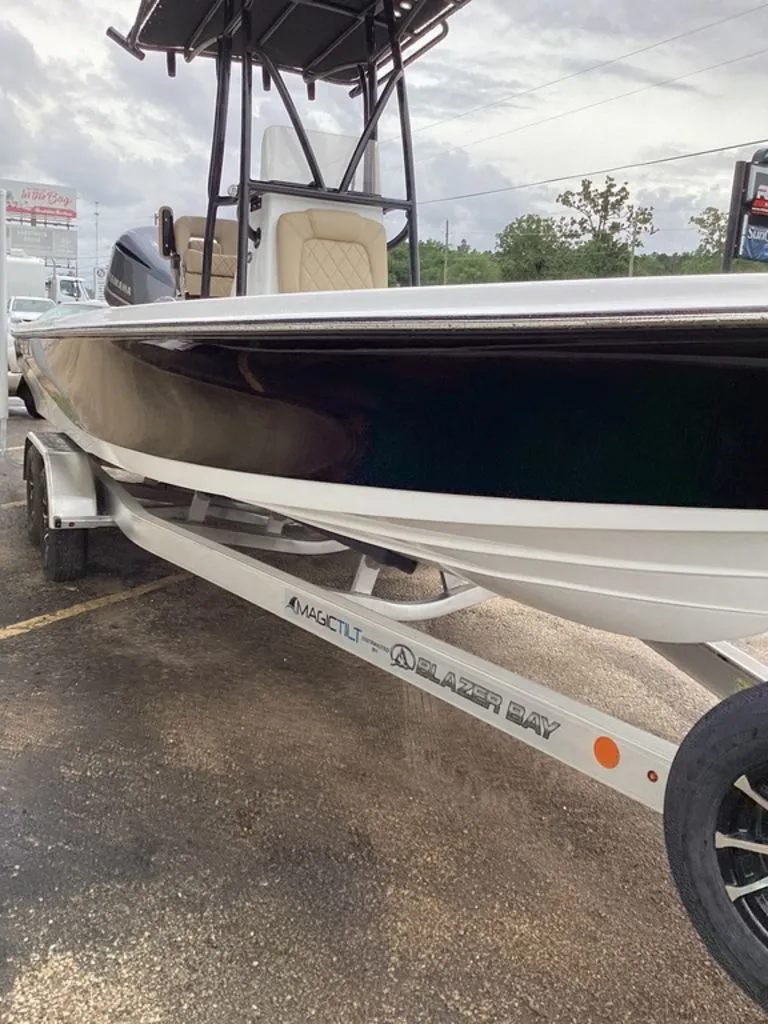 Slide: The Image of 2026 Blazer PureBay 2400 boat on trailer, side view. - 18