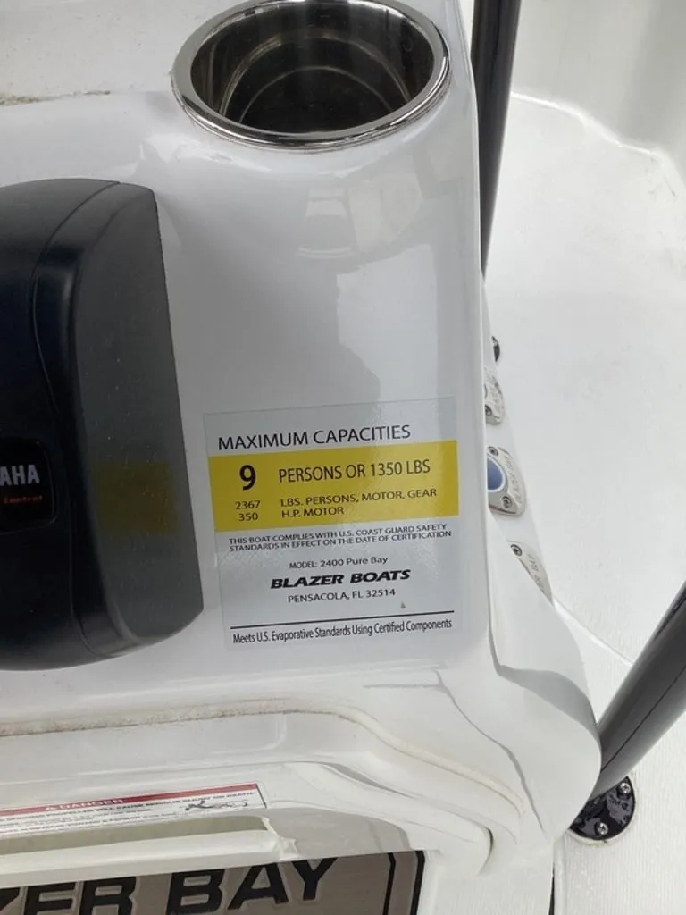 Slide: The Image of Blazer PureBay 2400 boat capacity label, 9 persons or 1350 lbs, year 2026. - 34
