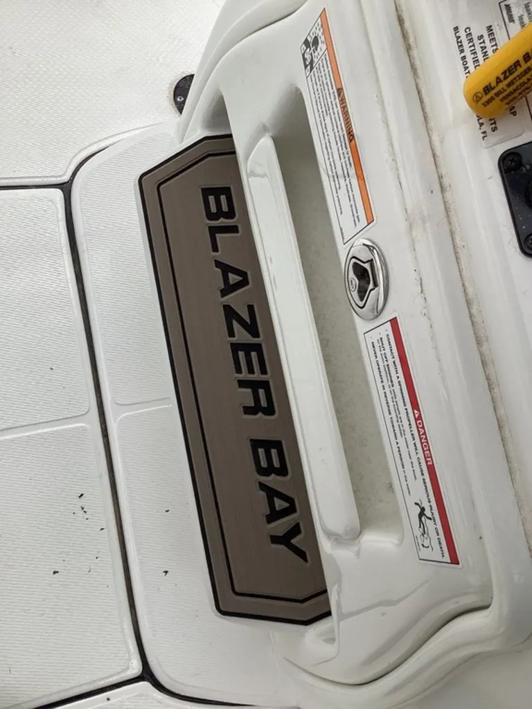 Slide: The Image of Blazer Bay PureBay 2400 boat, close-up of logo, year 2026. - 39