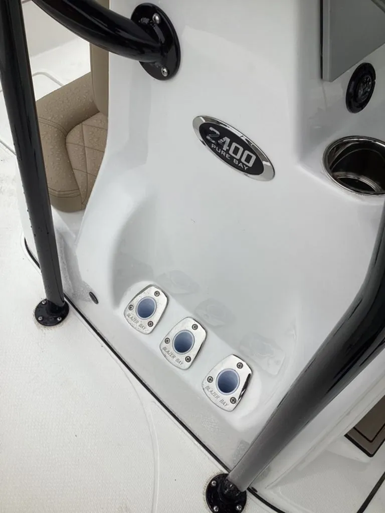 Slide: The Image of Blazer PureBay 2400 boat console with control buttons, year 2026. - 45