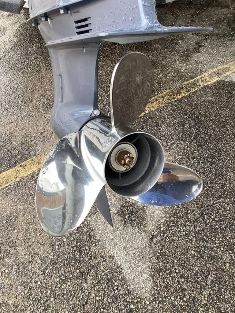 Slide: The Image of 2026 Blazer PureBay 2400 boat propeller on asphalt surface. - 5