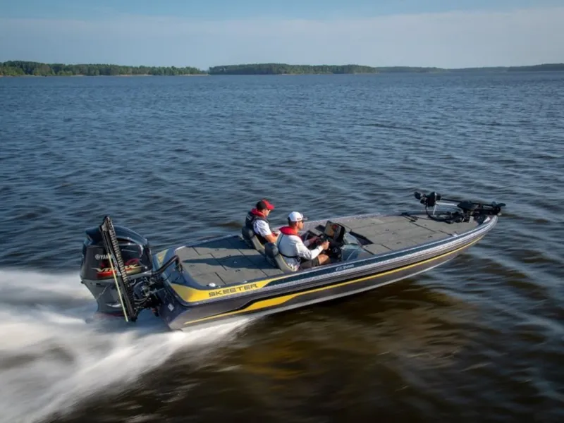 The Image of 2019 Skeeter ZX225 boat cruising on a calm lake. - 1