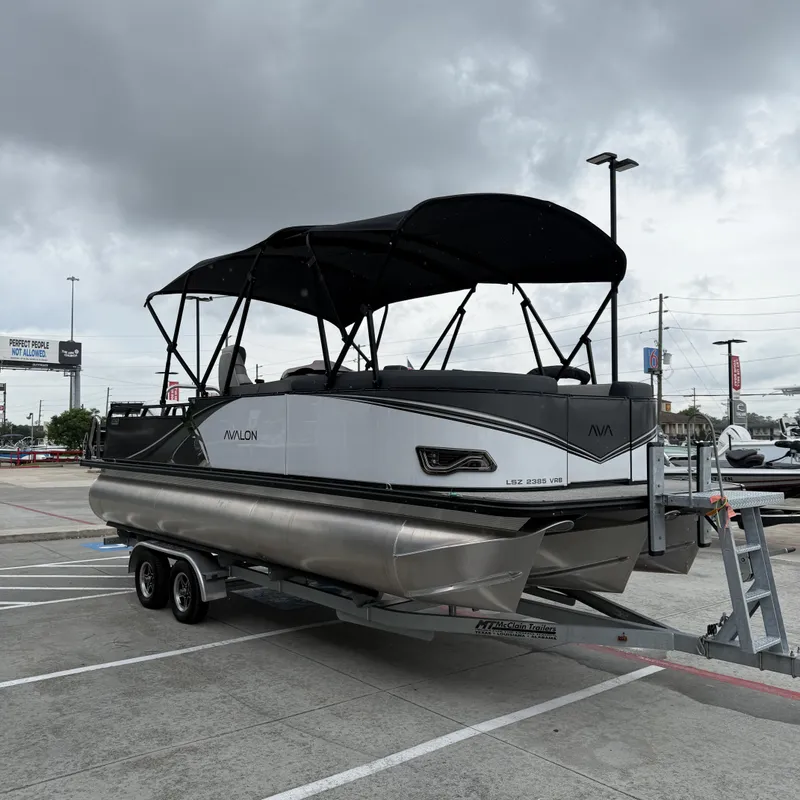Slide: The Image of 2025 Avalon Catalina Versatile Rear Bench on trailer, cloudy sky. - 5
