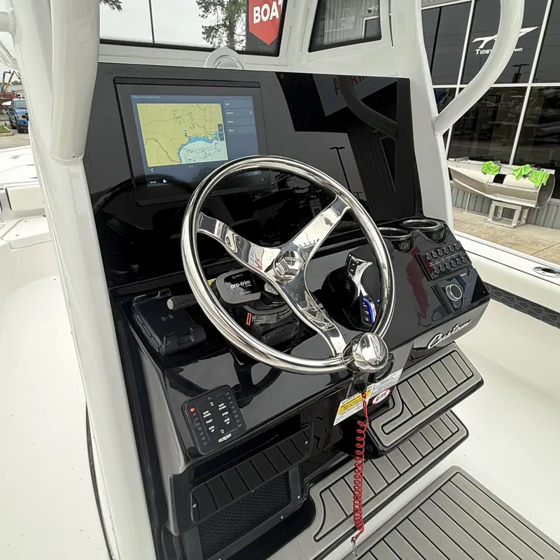 Slide: The Image of Tidewater 2500 Carolina Bay 2026 helm with navigation system. - 13