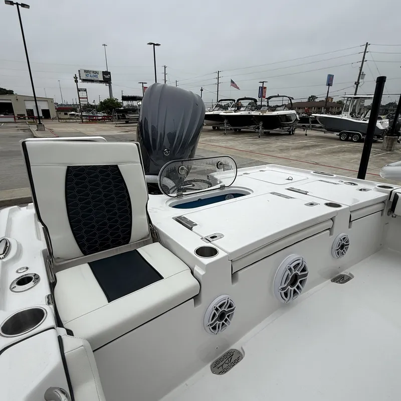 Slide: The Image of 2026 Tidewater 2500 Carolina Bay boat interior with seating and speakers. - 28