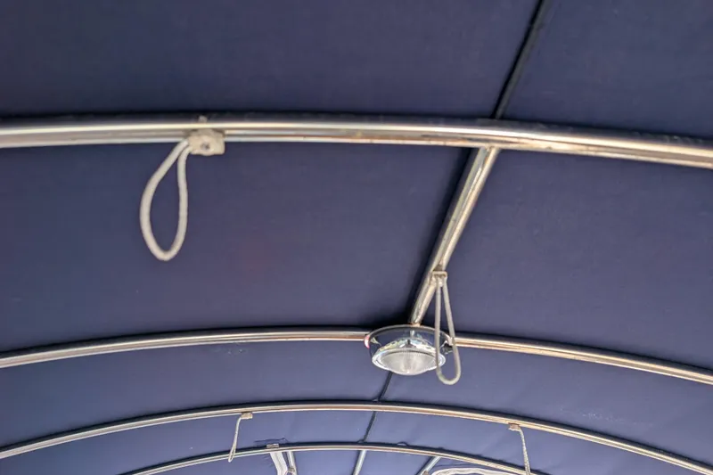 Slide: The Image of Interior view of a 2007 Duffy Cuddy Cabin 22 boat canopy with metal framework. - 15
