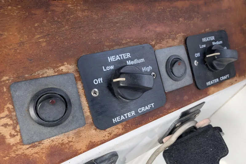 Slide: The Image of Control panel of a 2007 Duffy Cuddy Cabin 22 boat with heater settings. - 19