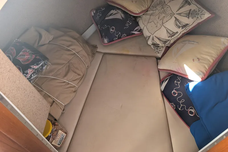 Slide: The Image of Cozy interior of 2007 Duffy Cuddy Cabin 22 with cushions and blankets. - 20