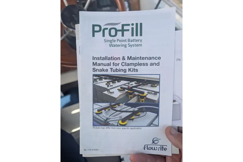 Slide: The Image of Manual for ProFill battery watering system, held inside a 2007 Duffy Cuddy Cabin 22 boat. - 25