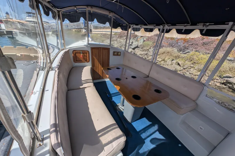 Slide: The Image of Interior of 2007 Duffy Cuddy Cabin 22 boat with seating and table. - 6
