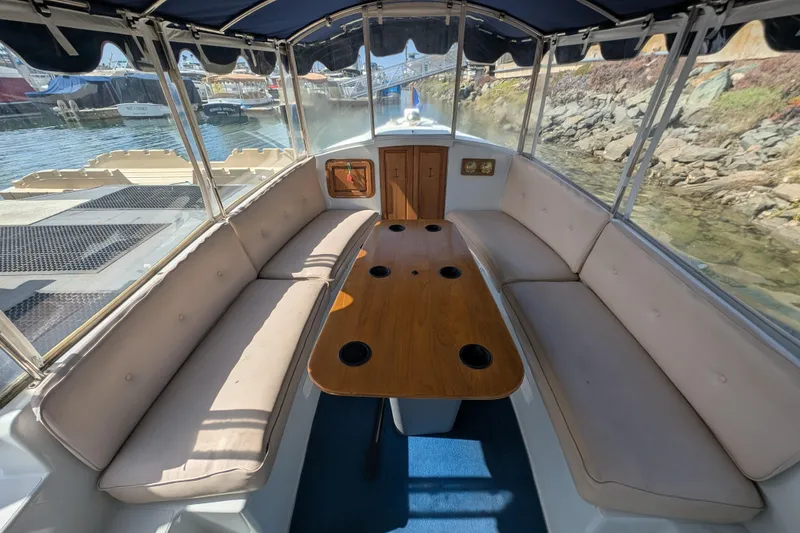 Slide: The Image of Interior of a 2007 Duffy Cuddy Cabin 22 boat with seating and table. - 8