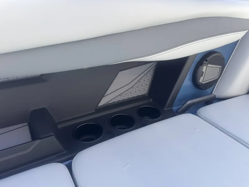 Slide: The Image of Interior of Axis A225 boat, 2026 model, featuring speaker and cup holders. - 10