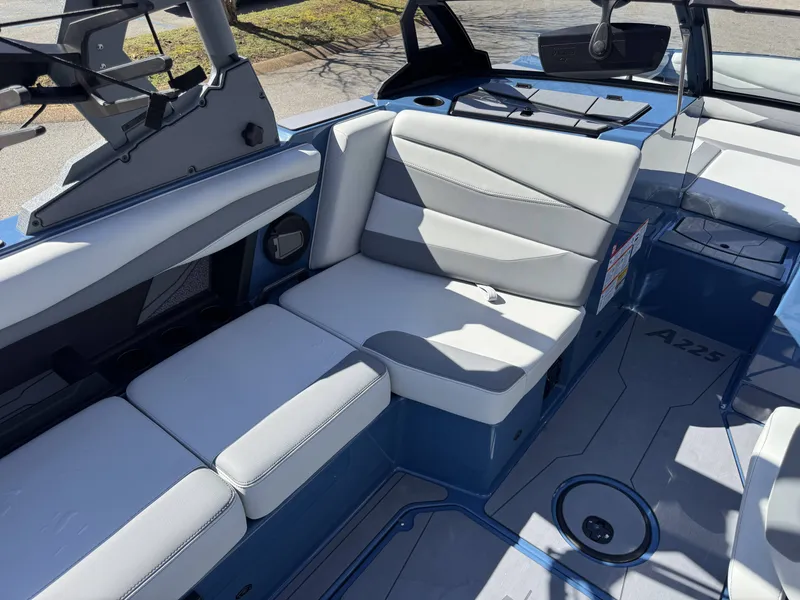 Slide: The Image of Interior of Axis A225 boat, 2026 model, featuring gray upholstery. - 11